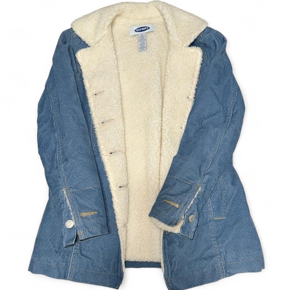 Blue denim jacket with cream fur lining jacket